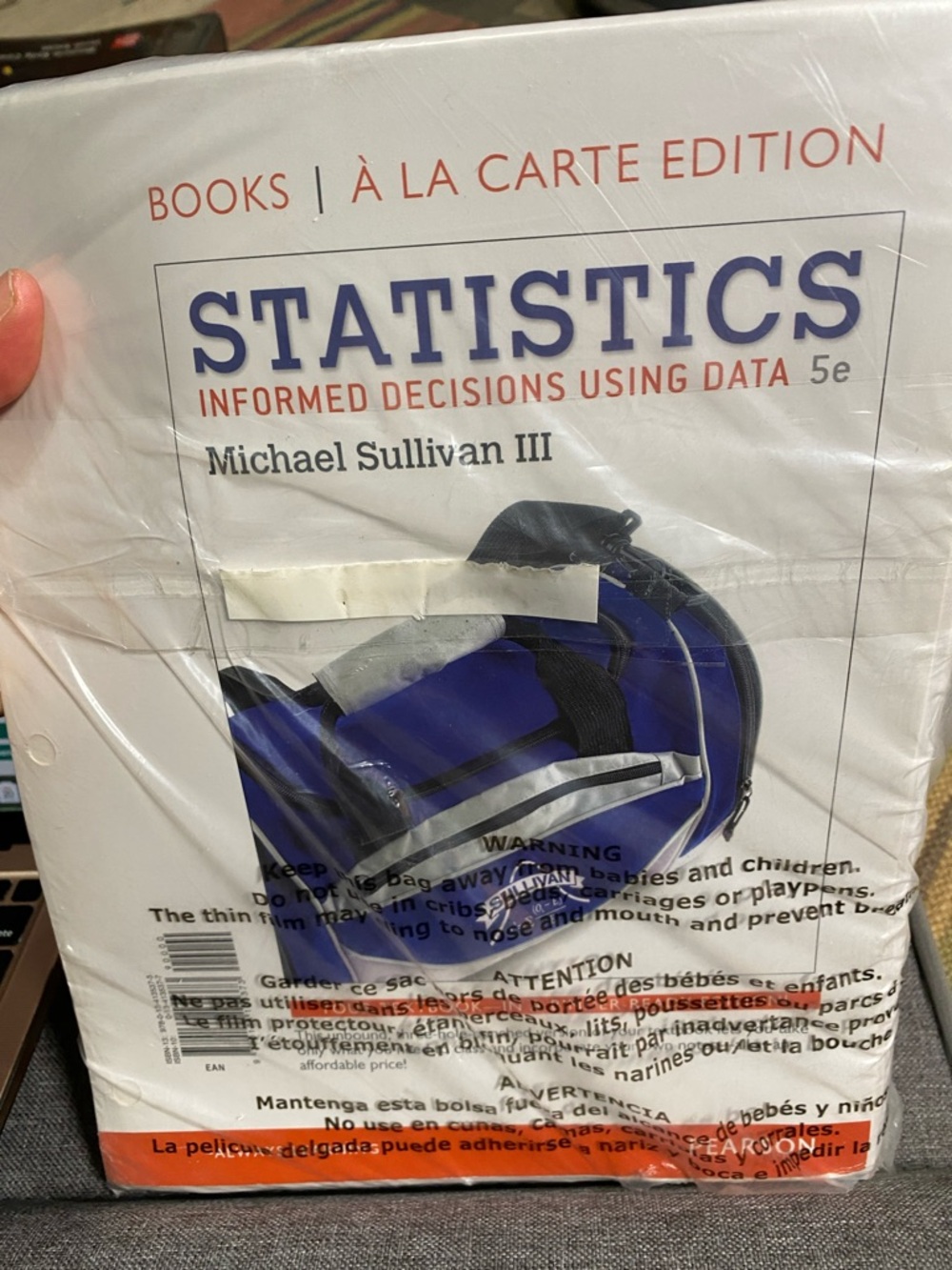 Pearson Textbook Wrapping with Orange Accent and White Field